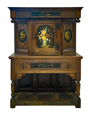 Lot 863 - An unusual carved and painted oak side cabinet.