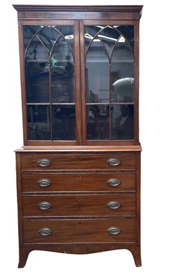 Lot 970 - An early 19th century mahogany bookcase chest.