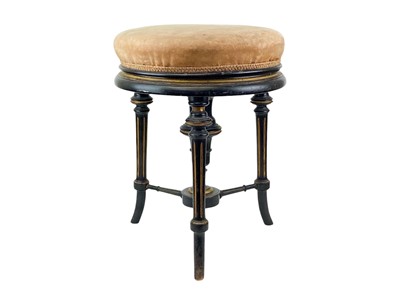 Lot 912 - A Victorian ebonised and gilt circular revolving piano or dressing table stool.