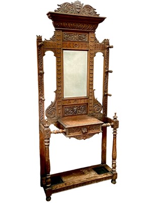 Lot 935 - A late Victorian carved oak hallstand.