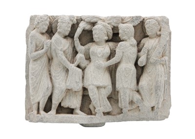 Lot 65 - A Gandharan carved schist panel, circa 3rd century.