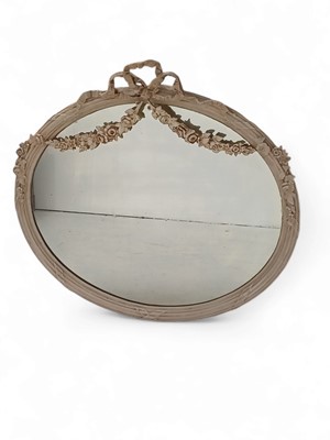 Lot 333 - An Edwardian neo-classical revival oval wall mirror.