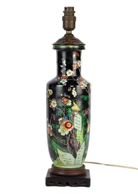 Lot 48 - A Chinese famille noire rouleau vase, 19th century.