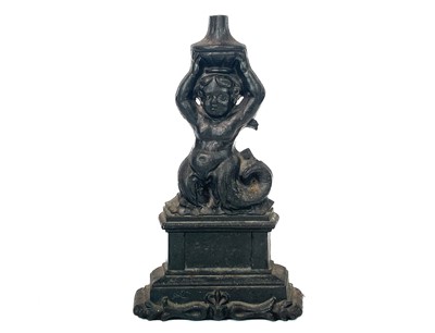 Lot 98 - A Coalbrookdale cast iron door stop.