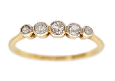 Lot 7 - An 18ct gold and platinum diamond five stone ring.