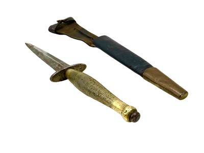 Lot 220 - An FS commando knife and scabbard, second pattern.