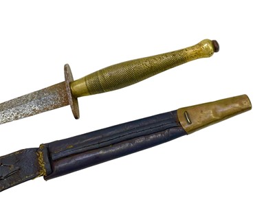 Lot 220 - An FS commando knife and scabbard, second pattern.