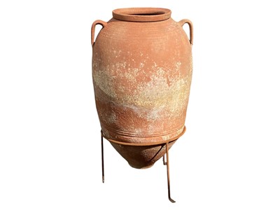 Lot 825 - A terracotta storage jar.