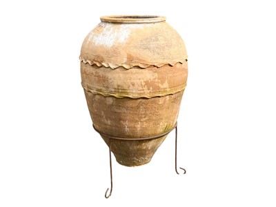 Lot 818 - A terracotta storage jar.