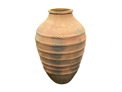 Lot 833 - A terracotta storage jar.