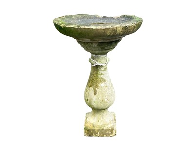 Lot 820 - A reconstituted stone bird bath.