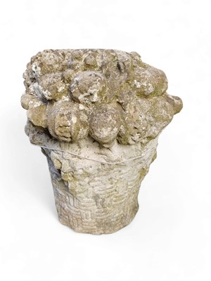 Lot 831 - A reconstituted stone basket of flowers