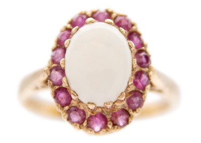 Lot 227 - A 9ct rose gold white opal and ruby set cluster ring.