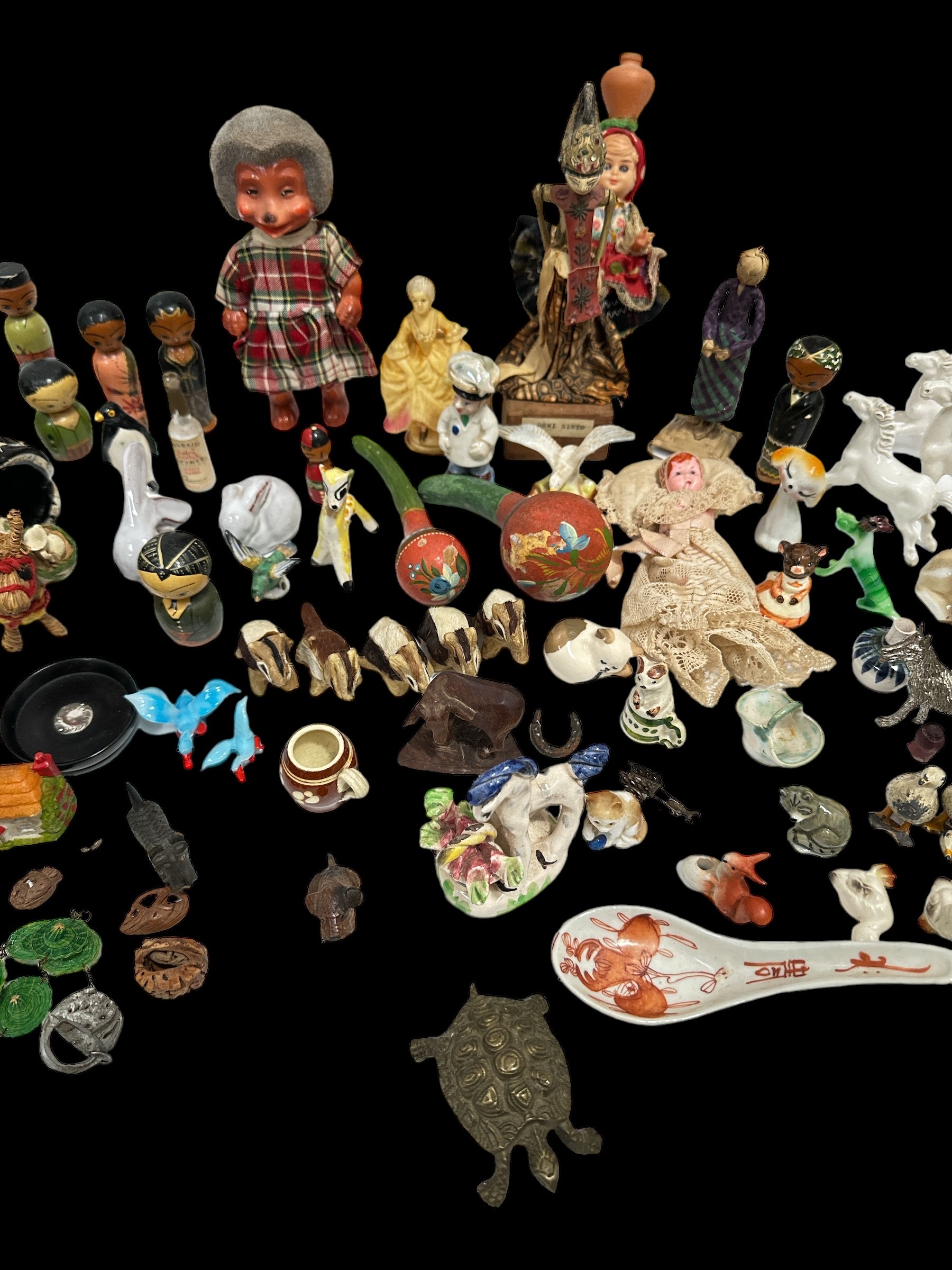 Lot 158 - A collection of small figures in a variety