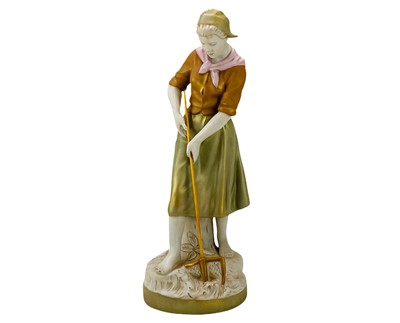 Lot 590 - A Royal Dux porcelain figure of a farm girl.