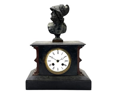 Lot 519 - A French rouge marble and black slate mantel clock.