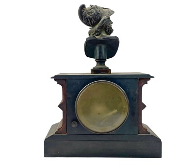 Lot 519 - A French rouge marble and black slate mantel clock.