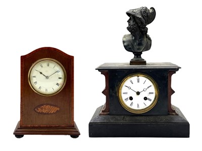 Lot 519 - A French rouge marble and black slate mantel clock.