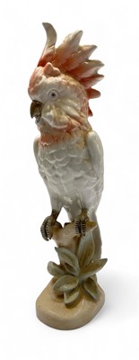 Lot 573 - A Royal Dux porcelain figure of a cockatoo perched on a branch.