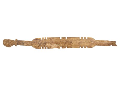 Lot 72 - Two Tuareg carved wood tent pegs.