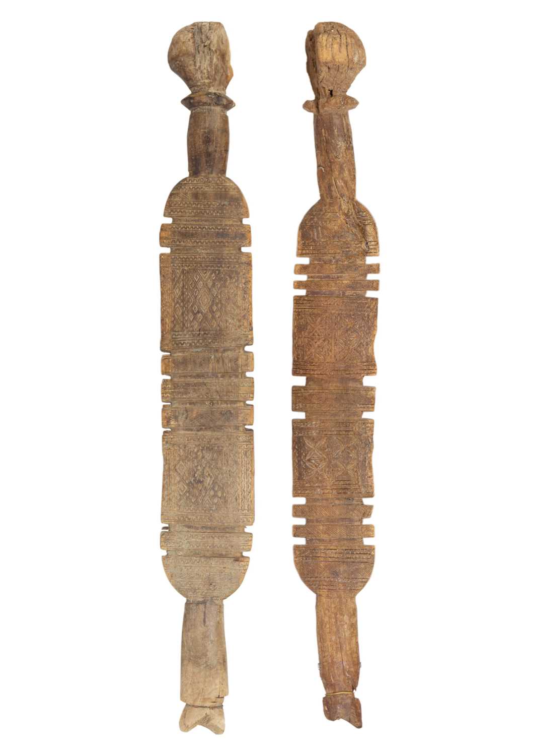 Lot 72 - Two Tuareg carved wood tent pegs.
