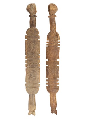 Lot 72 - Two Tuareg carved wood tent pegs.