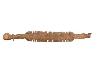 Lot 72 - Two Tuareg carved wood tent pegs.