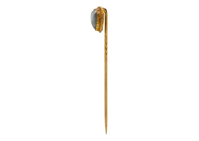 Lot 112 - A Victorian heart-shaped moonstone stick pin set in gold.