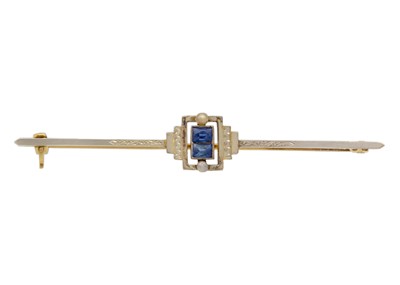 Lot 117 - An Art Deco yellow and white gold sapphire and seed pearl set bar brooch.