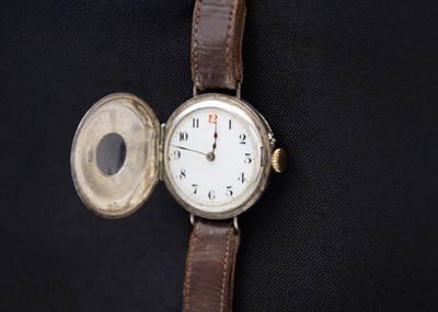 Lot 121 - An early 20th century silver cased half hunter Swiss cylinder lug wristwatch.