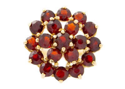 Lot 154 - A 9ct hallmarked gold garnet set cluster ring.