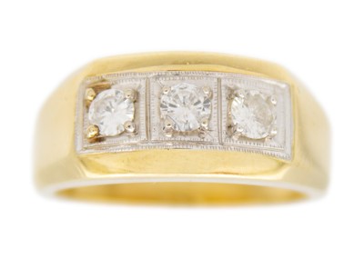 Lot 155 - An 18ct yellow and white gold diamond set three stone gentleman's ring.