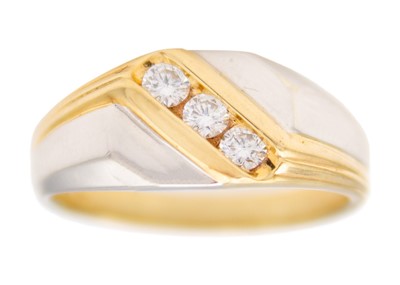 Lot 123 - A 9ct yellow and white hallmarked gold diamond set gentleman's three stone ring.