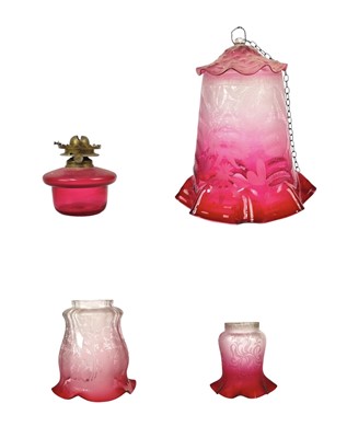 Lot 53 - A cranberry glass lampshade, and two others.