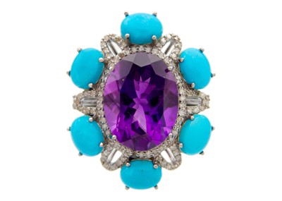 Lot 195 - A large amethyst, diamond, and turquoise set dress ring in white metal.