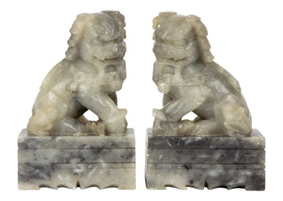 Lot 114 - A pair of Chinese soapstone dogs of fo, 20th century.