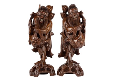 Lot 117 - A pair of Chinese carved hardwood figures, circa 1900.