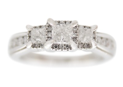 Lot 211 - A 14ct white gold princess cut diamond set three-stone ring