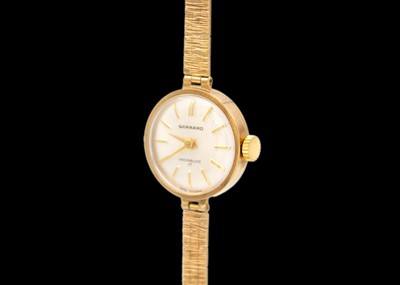 Lot 148 - GARRARD - An Incabloc 17 9ct lady's manual wind bracelet wristwatch.