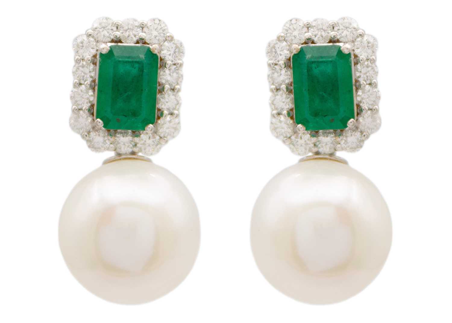 Lot 145 - A pair of 18ct white gold emerald diamond and white cultured pearl earrings.