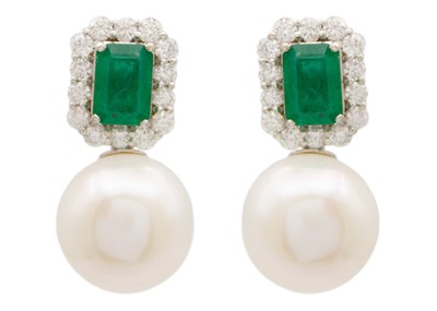 Lot 145 - A pair of 18ct white gold emerald diamond and white cultured pearl earrings.