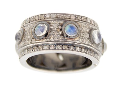 Lot 234 - A heavy silver full eternity ring set with cabochon moonstones and rose-cut diamonds.