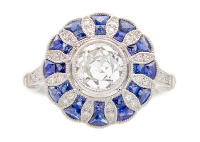 Lot 162 - An Art Deco style platinum diamond and sapphire set target ring.