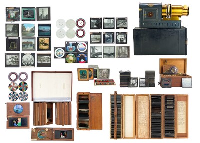 Lot 101 - A large collection of magic lantern slides, a Negretti & Zambra Magic Lantern and a pull-up screen.