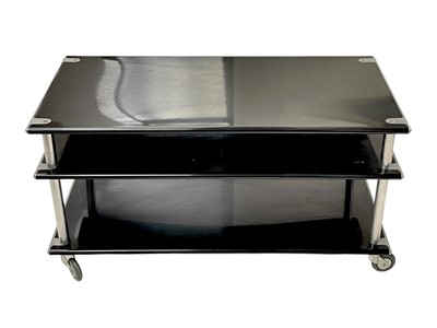 Lot 425 - A Habitat lacquered steel three tier side unit on castor wheels.