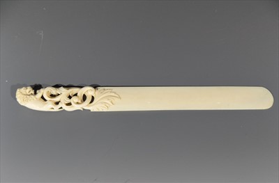 Lot 12 - An ivory paper knife, circa 1900, the...