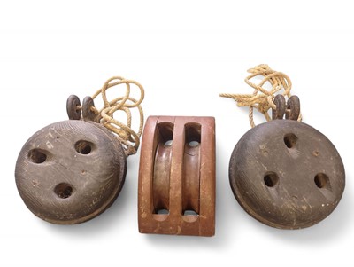 Lot 1126 - Two salvaged oak Dead-Eyes, and a Double Pulley Block