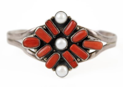 Lot 311 - A Native American silver coral and pearl set bracelet.