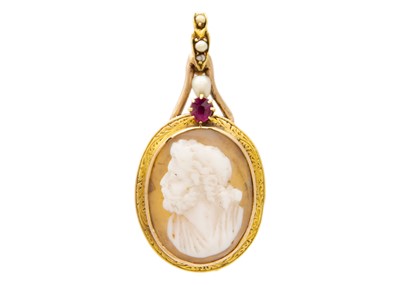 Lot 205 - A gold-mounted shell cameo pendant set with ruby and pearls.