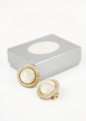 Lot 316 - CHRISTIAN DIOR - A pair of gold-tone faux pearl and crystal set clip earrings.